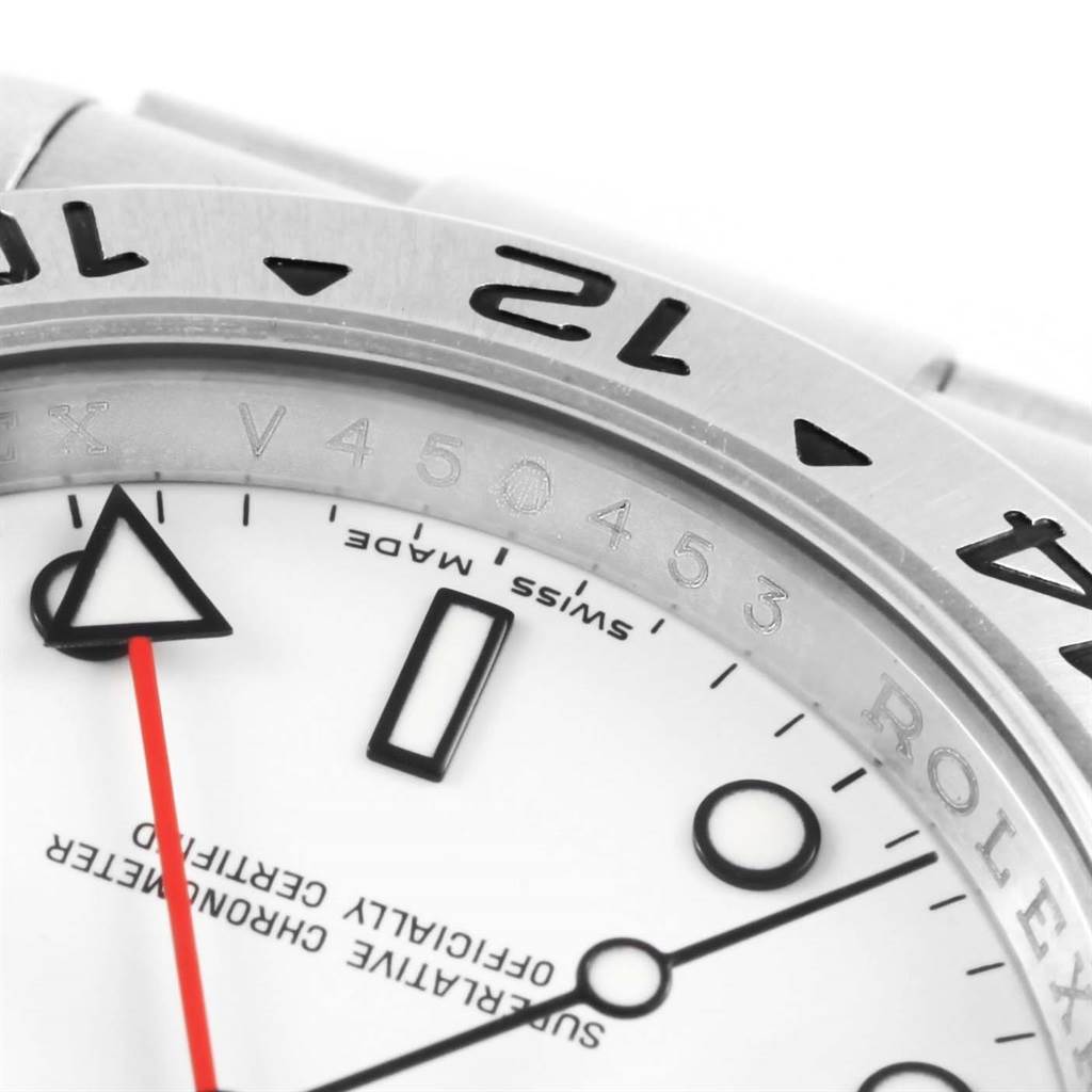 This close-up image shows the bezel, part of the dial, and the "Swiss Made" text of the Rolex Explorer 16570 Men's Stainless Steel White Dial 16570 Men's Stainless Steel White Dial watch.