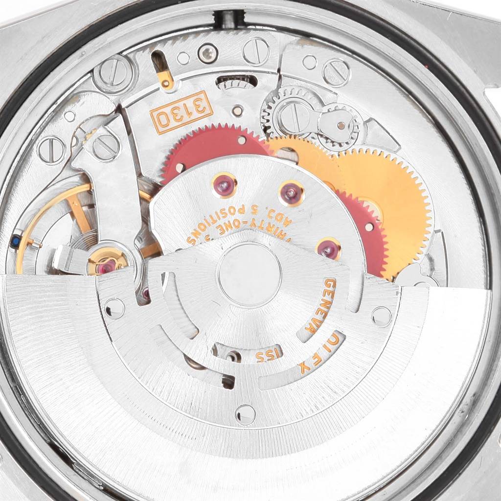 This is an image of the internal movement mechanism of a Rolex Explorer 114270 Men's Stainless Steel Black Dial 114270 Men's Stainless Steel Black Dial watch, showing gears and components.