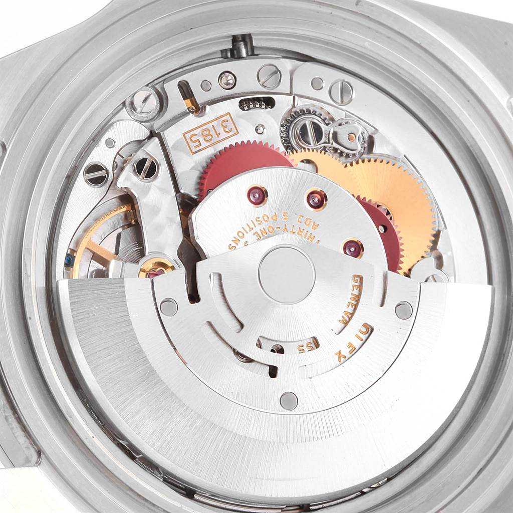 The image shows a close-up, angled view of the Rolex Explorer 16570 Men's Stainless Steel White Dial 16570 Men's Stainless Steel White Dial's movement, revealing its intricate gears and mechanisms.