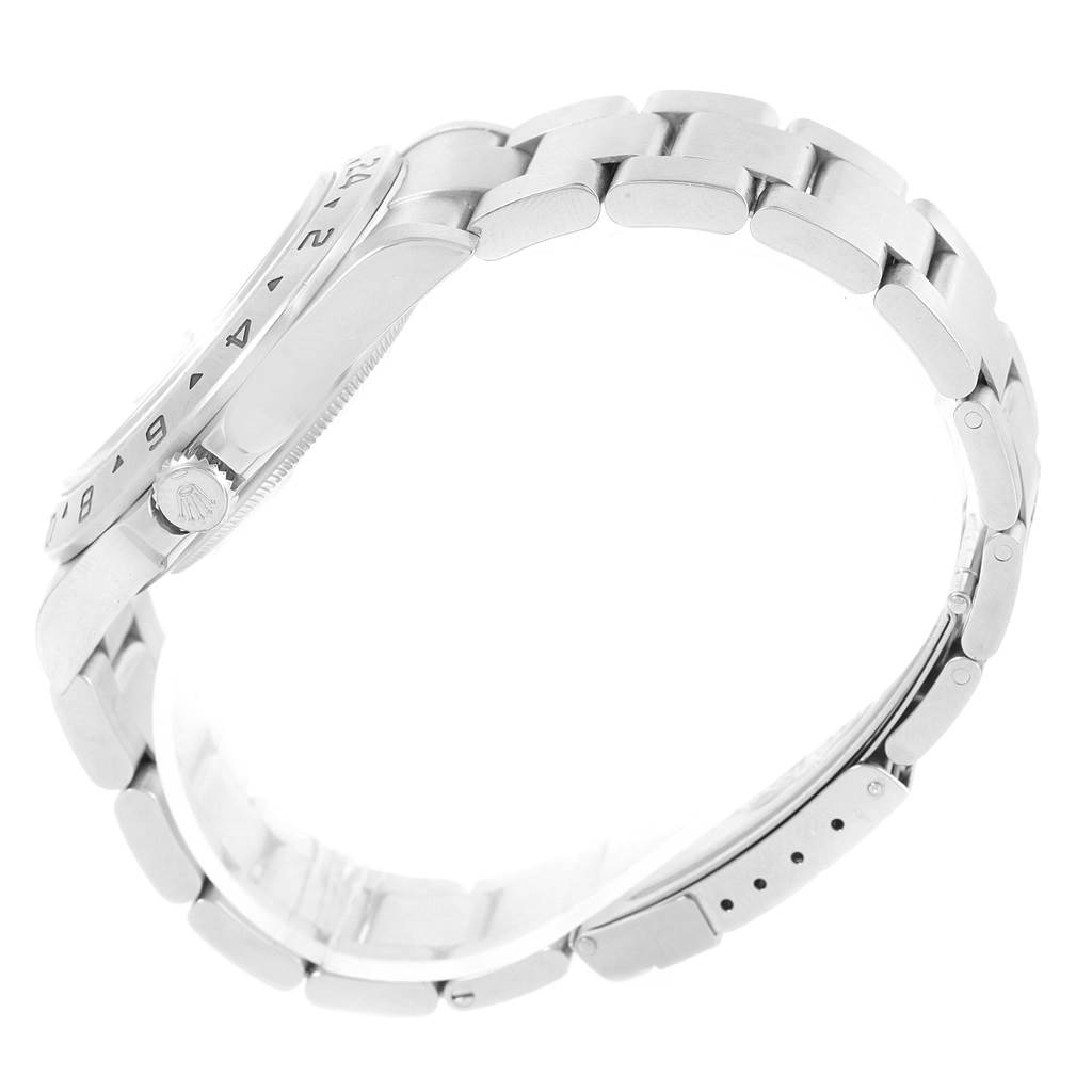 This is a side-angle view of a Rolex Explorer 16570 Men's Stainless Steel White Dial 16570 Men's Stainless Steel White Dial watch showing the case, bezel, crown, and bracelet.