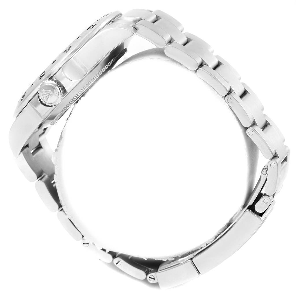 This side view of the Rolex Explorer 216570 Men's Stainless Steel White Dial 216570 Men's Stainless Steel White Dial watch showcases the crown and portion of the bracelet.