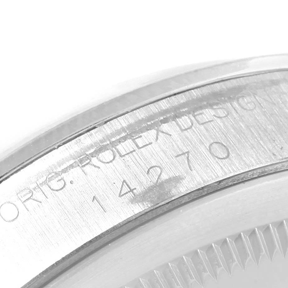 This image shows a close-up of the serial number and detailing on the case of a Rolex Explorer 14270 Men's Stainless Steel Black Dial 14270 Men's Stainless Steel Black Dial watch.