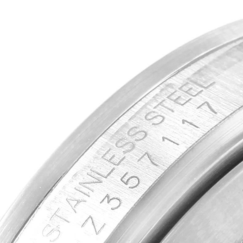 The image shows a close-up of the bezel engraving on a stainless steel Rolex Explorer 16570 Men's Stainless Steel Black Dial 16570 Men's Stainless Steel Black Dial watch.