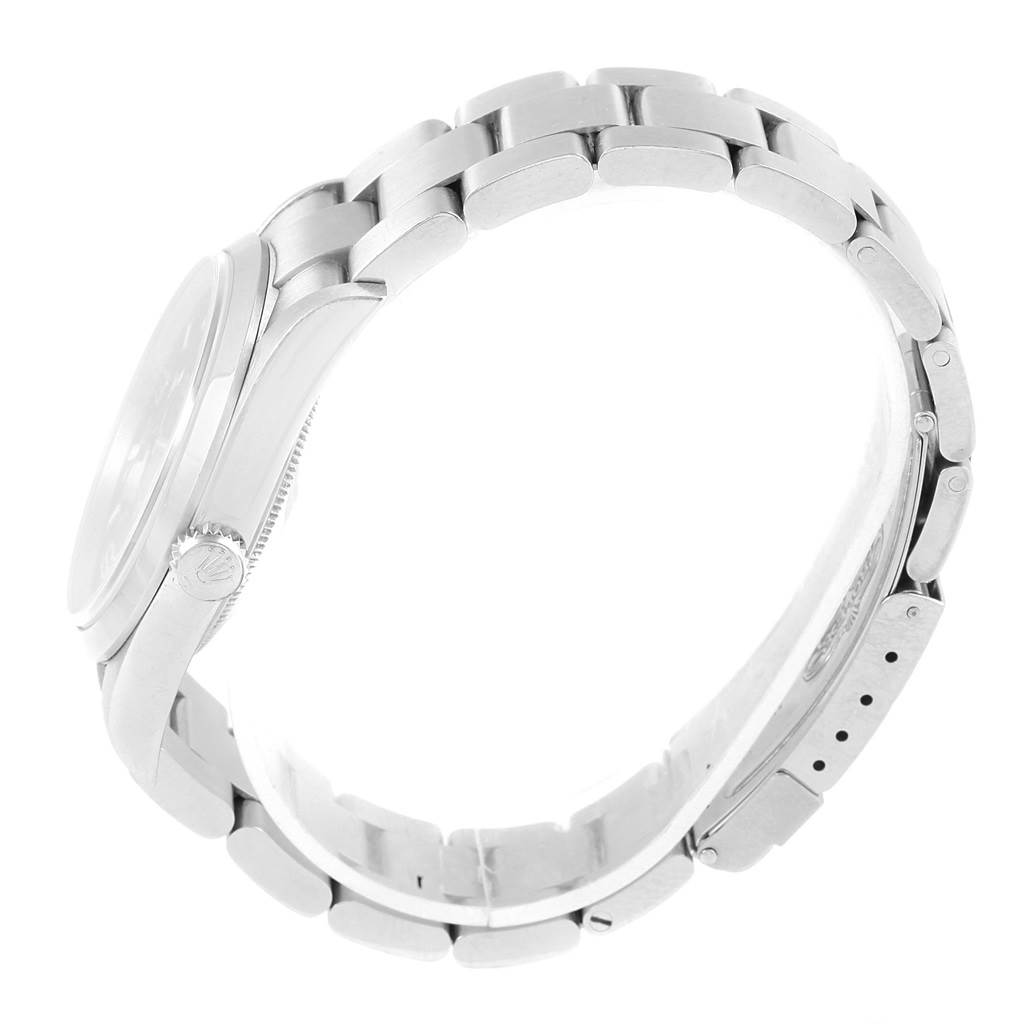 The image shows a side view of the Rolex Explorer 114270 Men's Stainless Steel Black Dial 114270 Men's Stainless Steel Black Dial watch with its crown, case, and bracelet visible.