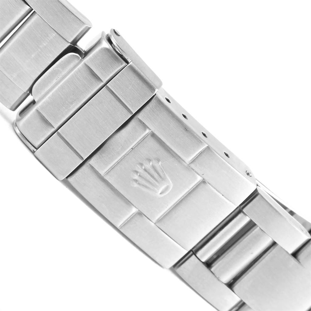 The image shows a close-up of the clasp and part of the bracelet of the Rolex Explorer 16570 Men's Stainless Steel Black Dial 16570 Men's Stainless Steel Black Dial watch.