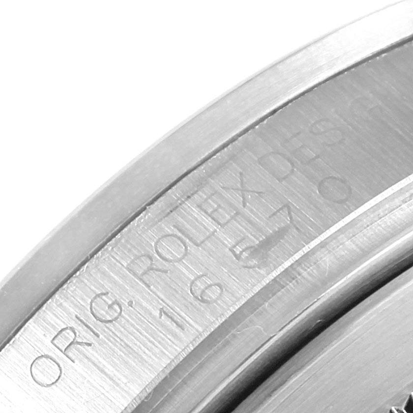 The image shows a close-up of the engraved inner bezel of a Rolex Explorer 16570 Men's Stainless Steel Black Dial 16570 Men's Stainless Steel Black Dial watch.
