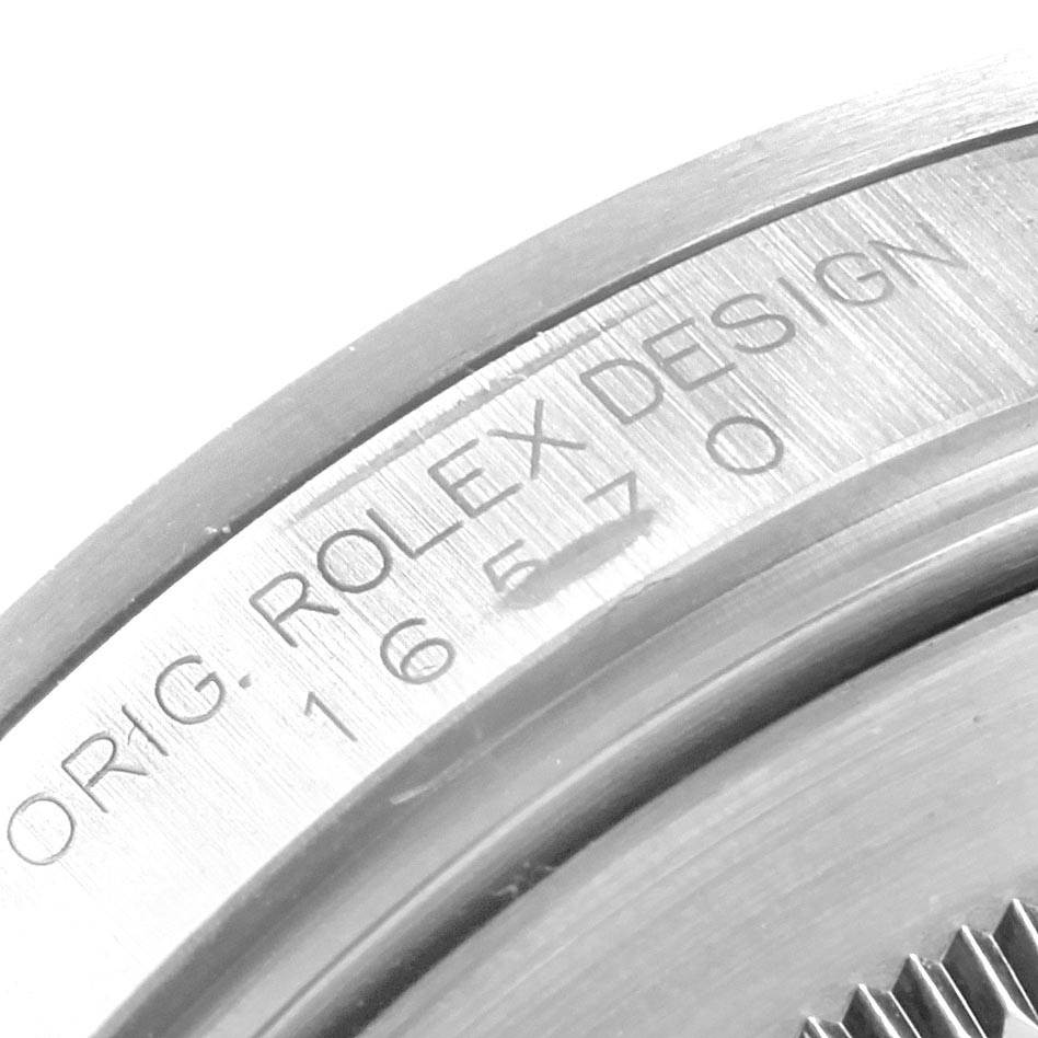 The image shows the engraved caseback of a Rolex Explorer 16570 Men's Stainless Steel Black Dial 16570 Men's Stainless Steel Black Dial model, highlighting the serial number and design details.