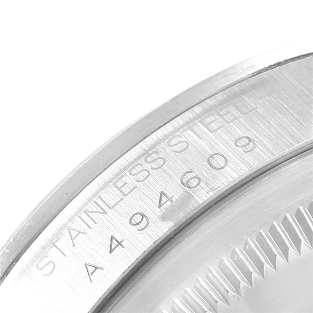 This image shows a close-up of the stainless steel case back edge with engraving on a Rolex Explorer 14270 Men's Stainless Steel Black Dial 14270 Men's Stainless Steel Black Dial model watch.