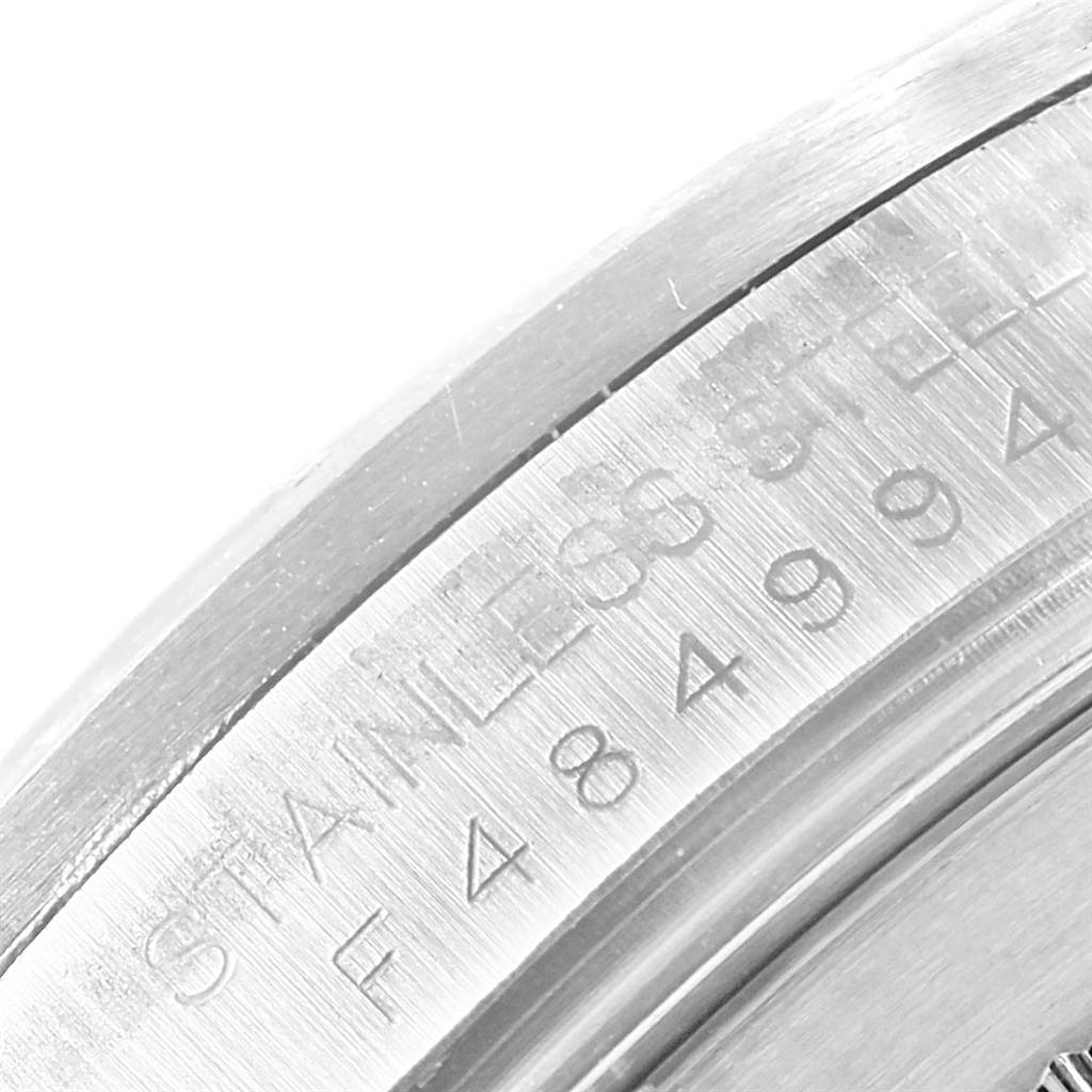 This close-up image shows the engraved stainless steel back of a Rolex Explorer 16570 Men's Stainless Steel White Dial 16570 Men's Stainless Steel White Dial watch.