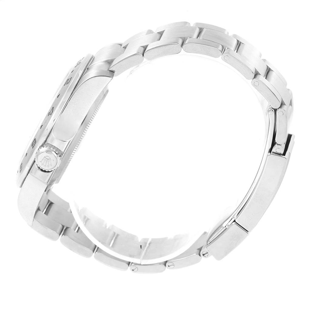 The image shows a side view of a Rolex Explorer 216570 Men's Stainless Steel White Dial 216570 Men's Stainless Steel White Dial watch, focusing on its metal bracelet and crown.