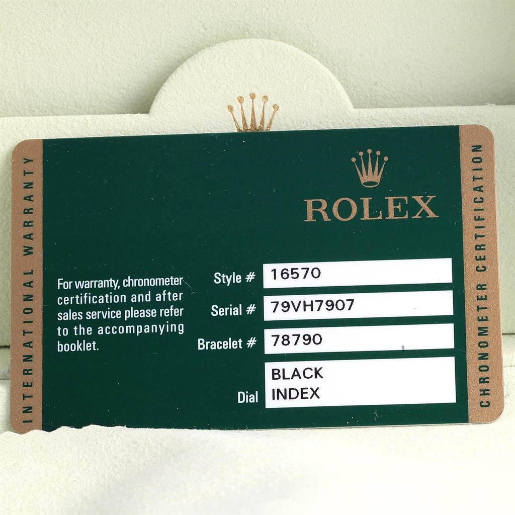 The image shows an international warranty card with details for the Rolex Explorer 16570 Men's Stainless Steel Black Dial 16570 Men's Stainless Steel Black Dial model, including style, serial, bracelet numbers, and dial type.