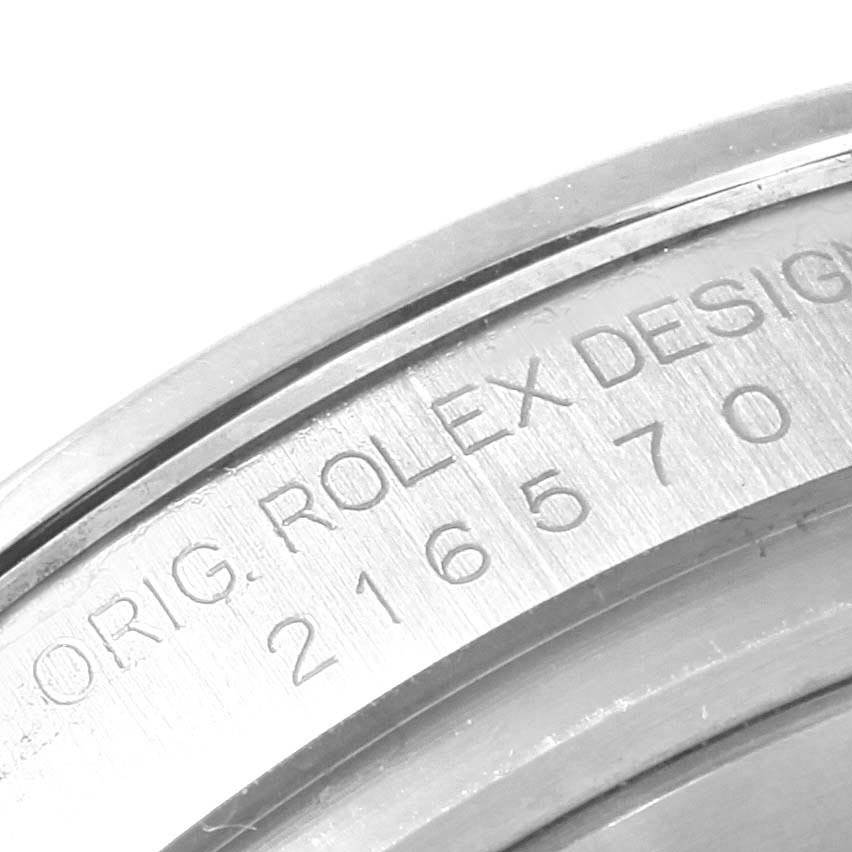 This close-up image shows the serial number on the case of a Rolex Explorer 216570 Men's Stainless Steel White Dial 216570 Men's Stainless Steel White Dial watch.
