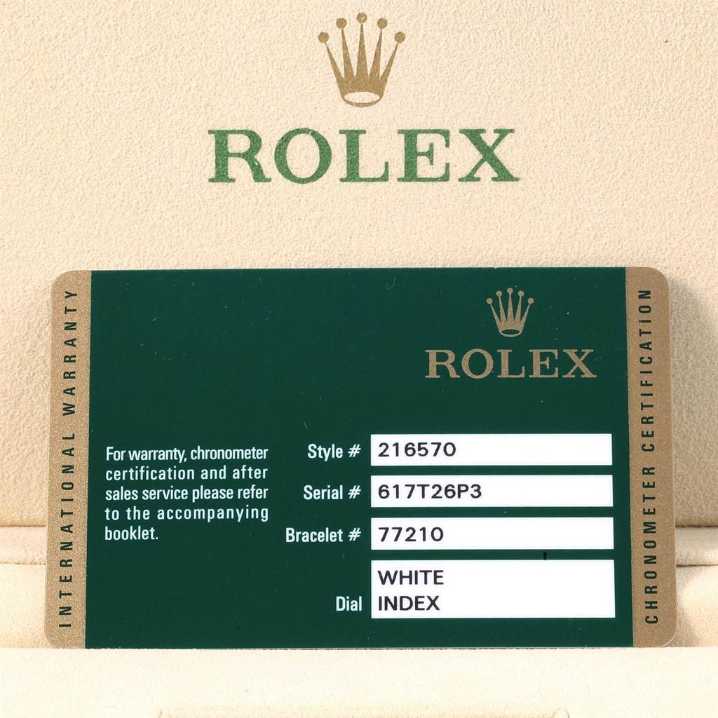 The image shows the warranty card for the Rolex Explorer 216570 Men's Stainless Steel White Dial 216570 Men's Stainless Steel White Dial model, indicating the style, serial, and bracelet numbers, along with the dial description.