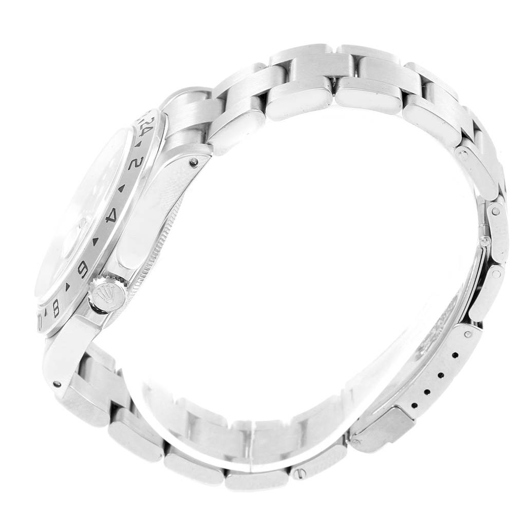 The image shows a side profile of a Rolex Explorer 16570 Men's Stainless Steel Black Dial 16570 Men's Stainless Steel Black Dial watch highlighting its silver bracelet and crown.