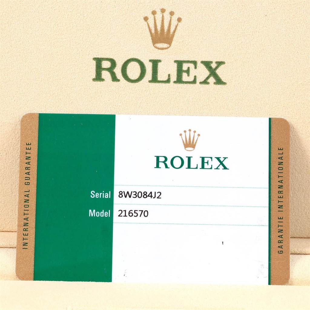 The image shows the serial and model details card for a Rolex Explorer 216570 Men's Stainless Steel White Dial 216570 Men's Stainless Steel White Dial model 216570 watch.