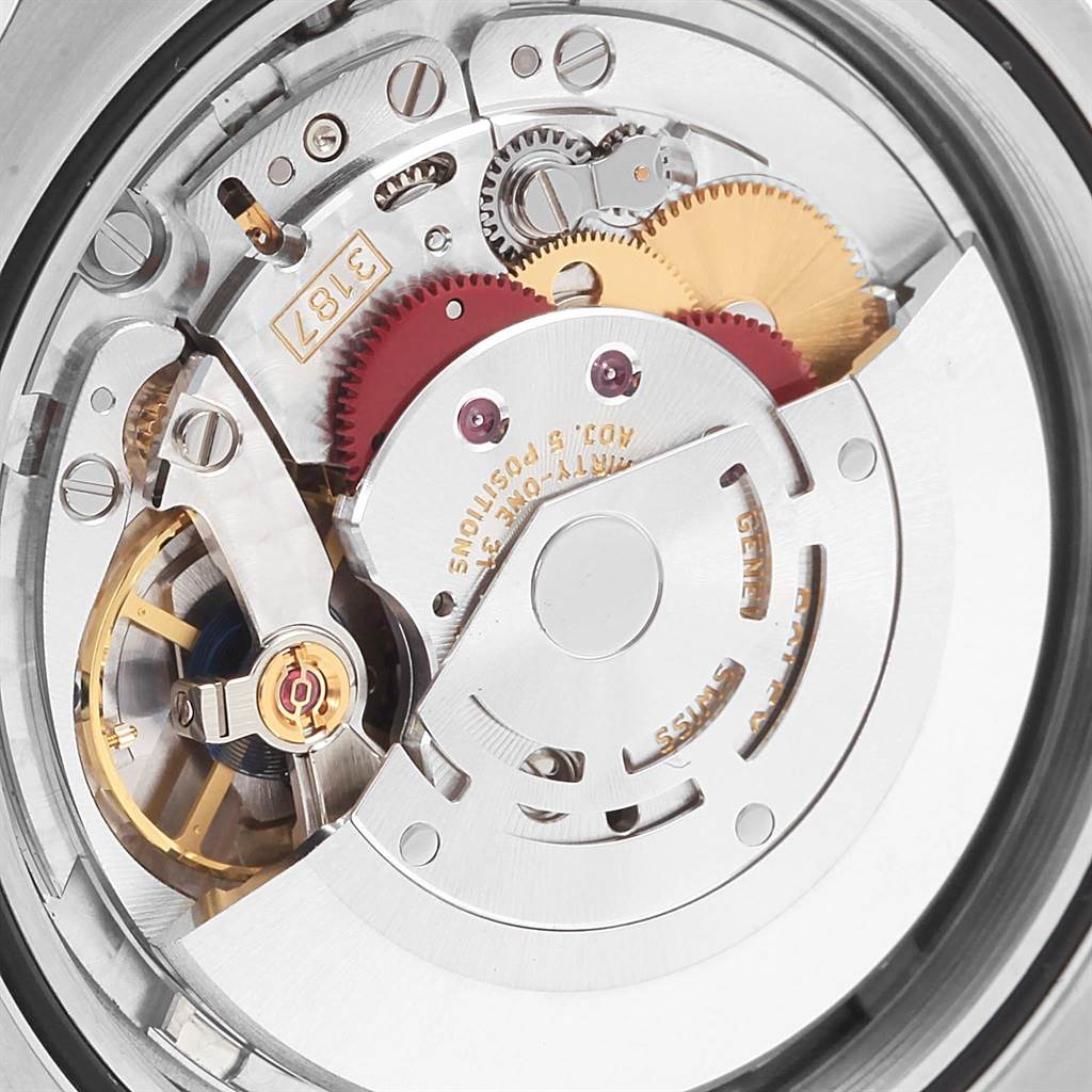 This is a close-up view of the internal mechanics of a Rolex Explorer 216570 Men's Stainless Steel White Dial 216570 Men's Stainless Steel White Dial watch, showcasing its gears and movement components.