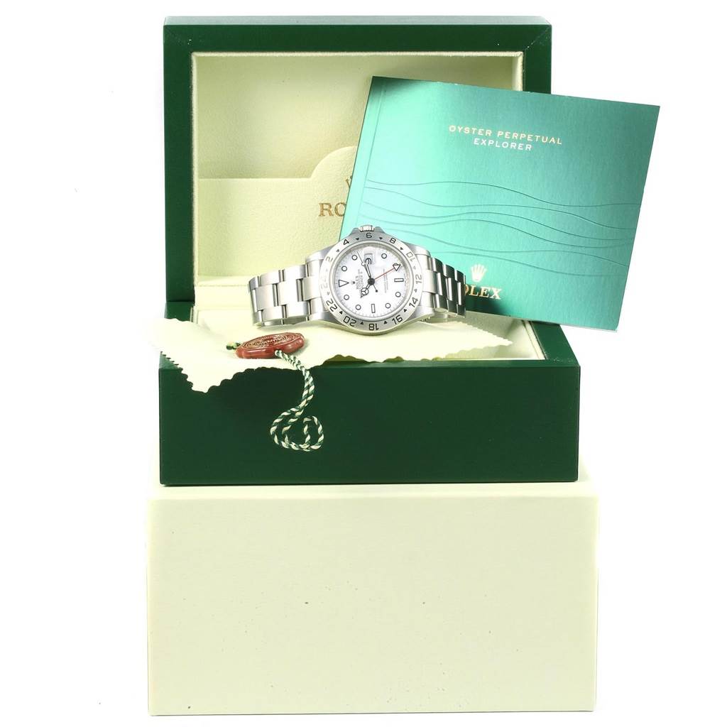 The image shows a Rolex Explorer 16570 Men's Stainless Steel White Dial 16570 Men's Stainless Steel White Dial watch in its box, with the manual and tag displayed.