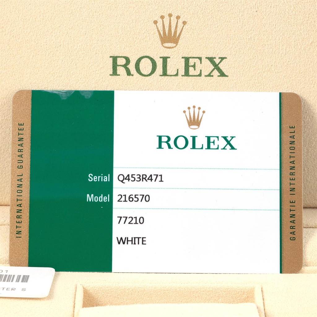 This image shows a Rolex international guarantee card for the Explorer model, displaying serial and model numbers.