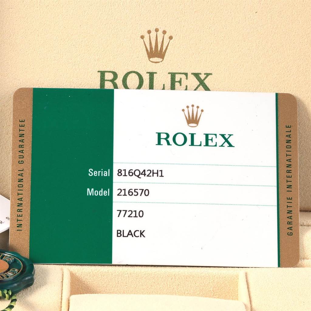 The image shows a Rolex Explorer 216570 Men's Stainless Steel Black Dial 216570 Men's Stainless Steel Black Dial model 216570 warranty card, including the serial number and color information.