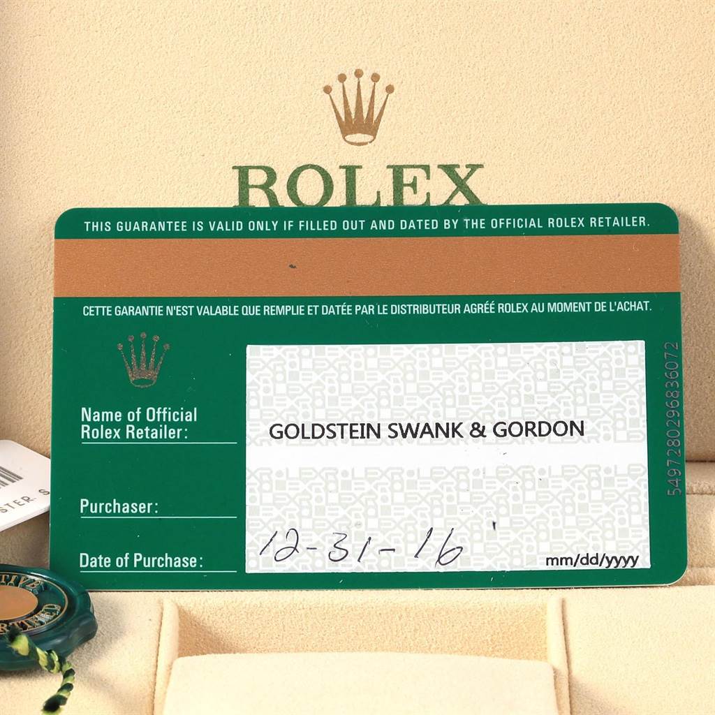 The image shows a guarantee card for the Rolex Explorer 216570 Men's Stainless Steel Black Dial 216570 Men's Stainless Steel Black Dial model, alongside a tag and part of the packaging box.