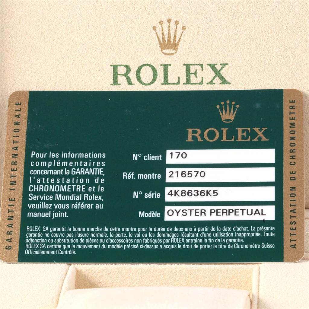 This image shows the warranty card and information for a Rolex Explorer 216570 Men's Stainless Steel White Dial 216570 Men's Stainless Steel White Dial model watch.