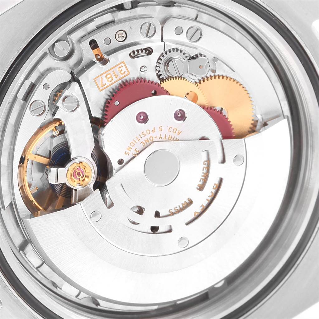 This is a close-up view of the Rolex Explorer 216570 Men's Stainless Steel White Dial 216570 Men's Stainless Steel White Dial watch's internal mechanism, showcasing gears and components of the movement.