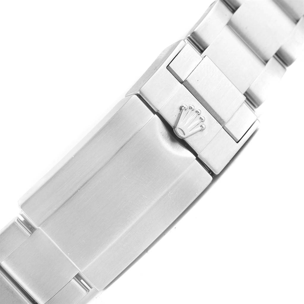 The image shows the clasp section of a Rolex Explorer 216570 Men's Stainless Steel Black Dial 216570 Men's Stainless Steel Black Dial model watch bracelet, featuring the iconic Rolex crown logo.