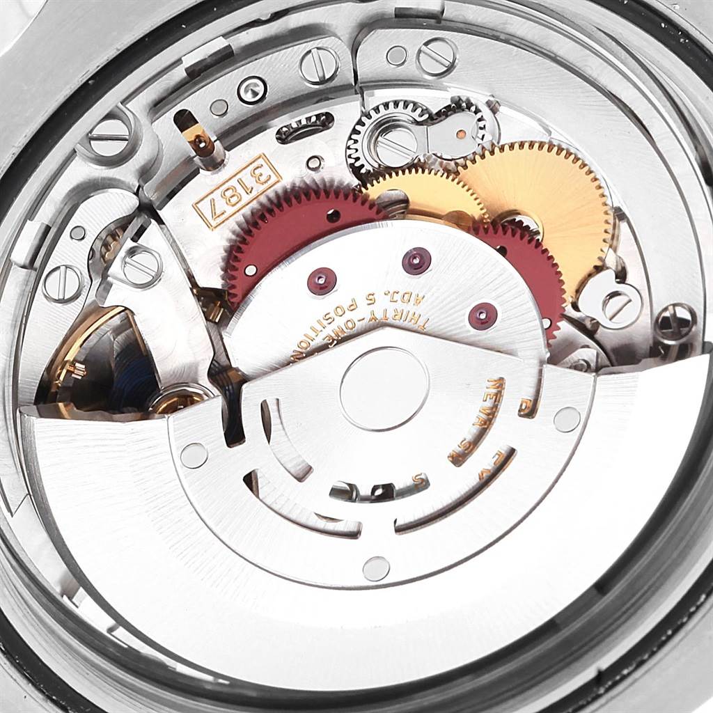 The image shows a close-up view of the intricate movement and inner mechanics of a Rolex Explorer 216570 Men's Stainless Steel Black Dial 216570 Men's Stainless Steel Black Dial watch.