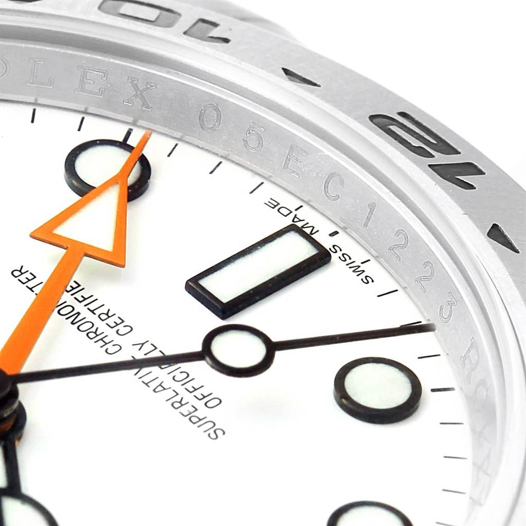 This image shows a close-up angle of the Rolex Explorer 216570 Men's Stainless Steel White Dial 216570 Men's Stainless Steel White Dial model watch, focusing on the bezel, dial, and hands.