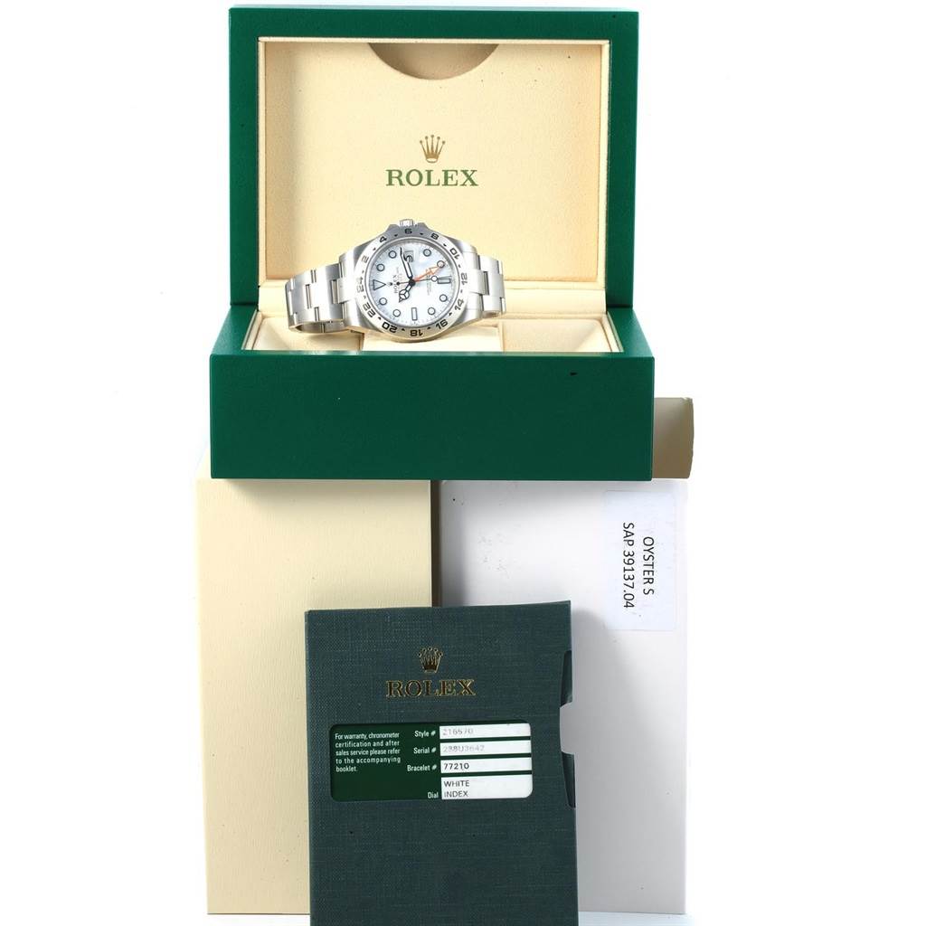 The image shows a Rolex Explorer 216570 Men's Stainless Steel White Dial 216570 Men's Stainless Steel White Dial watch inside its branded box, along with warranty cards and packaging.