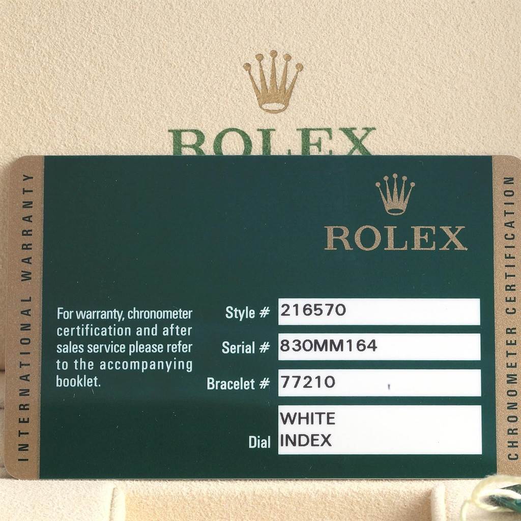 This image shows an international warranty card for a Rolex Explorer 216570 Men's Stainless Steel White Dial 216570 Men's Stainless Steel White Dial model watch.
