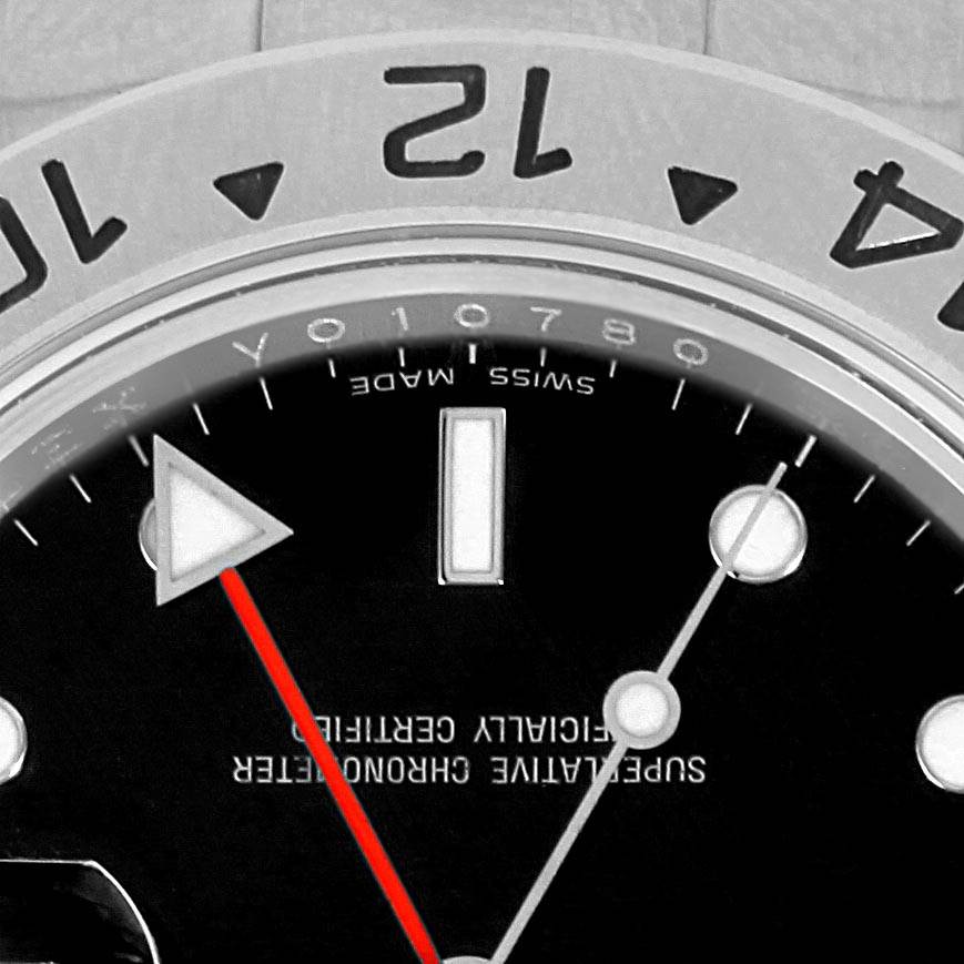 The image shows a close-up of the dial and bezel of a Rolex Explorer 16570 Men's Stainless Steel Black Dial 16570 Men's Stainless Steel Black Dial, focusing on the 12 o'clock marker, hands, and part of the text on the dial.