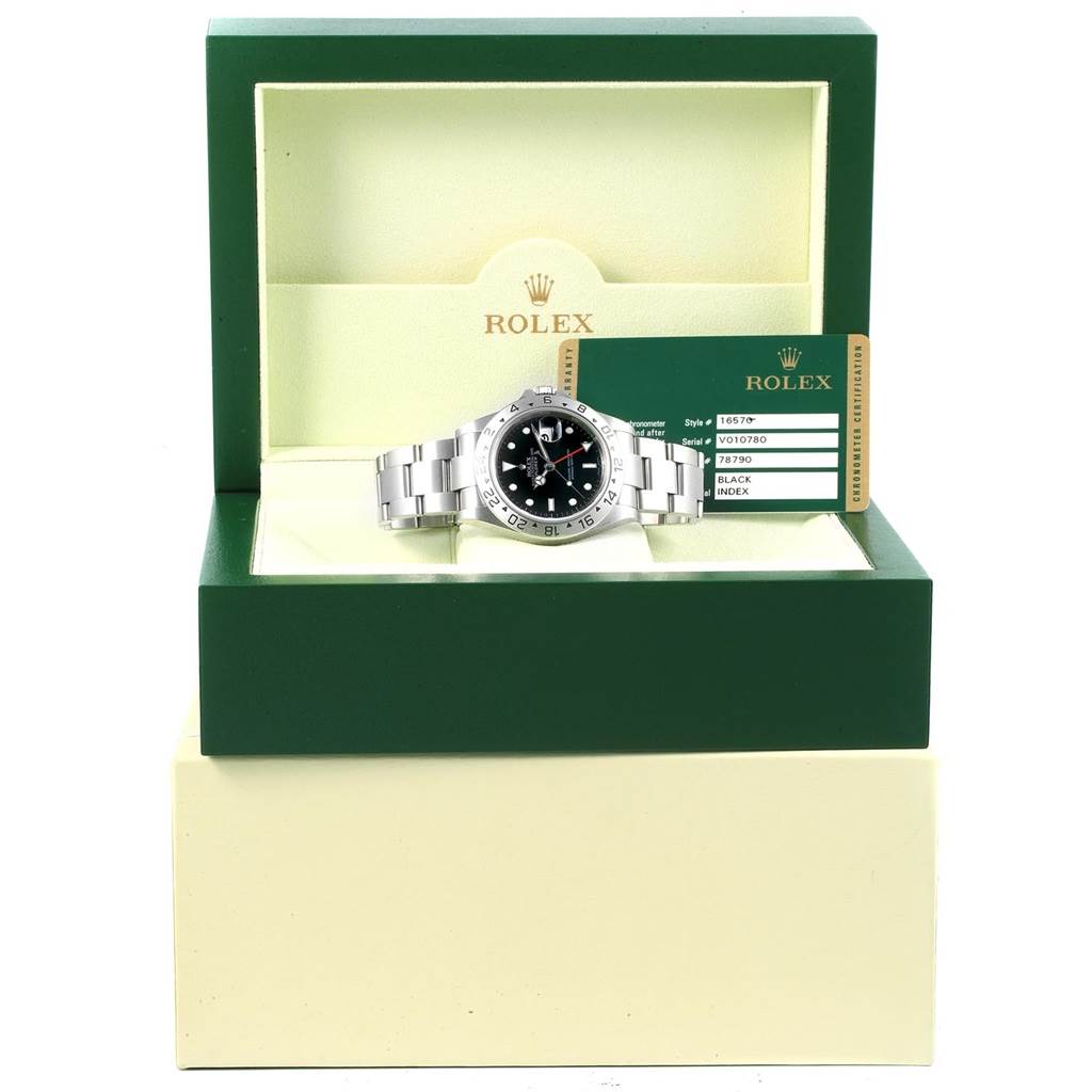 The Rolex Explorer 16570 Men's Stainless Steel Black Dial 16570 Men's Stainless Steel Black Dial watch is shown in its open box with a certification card on the right side.