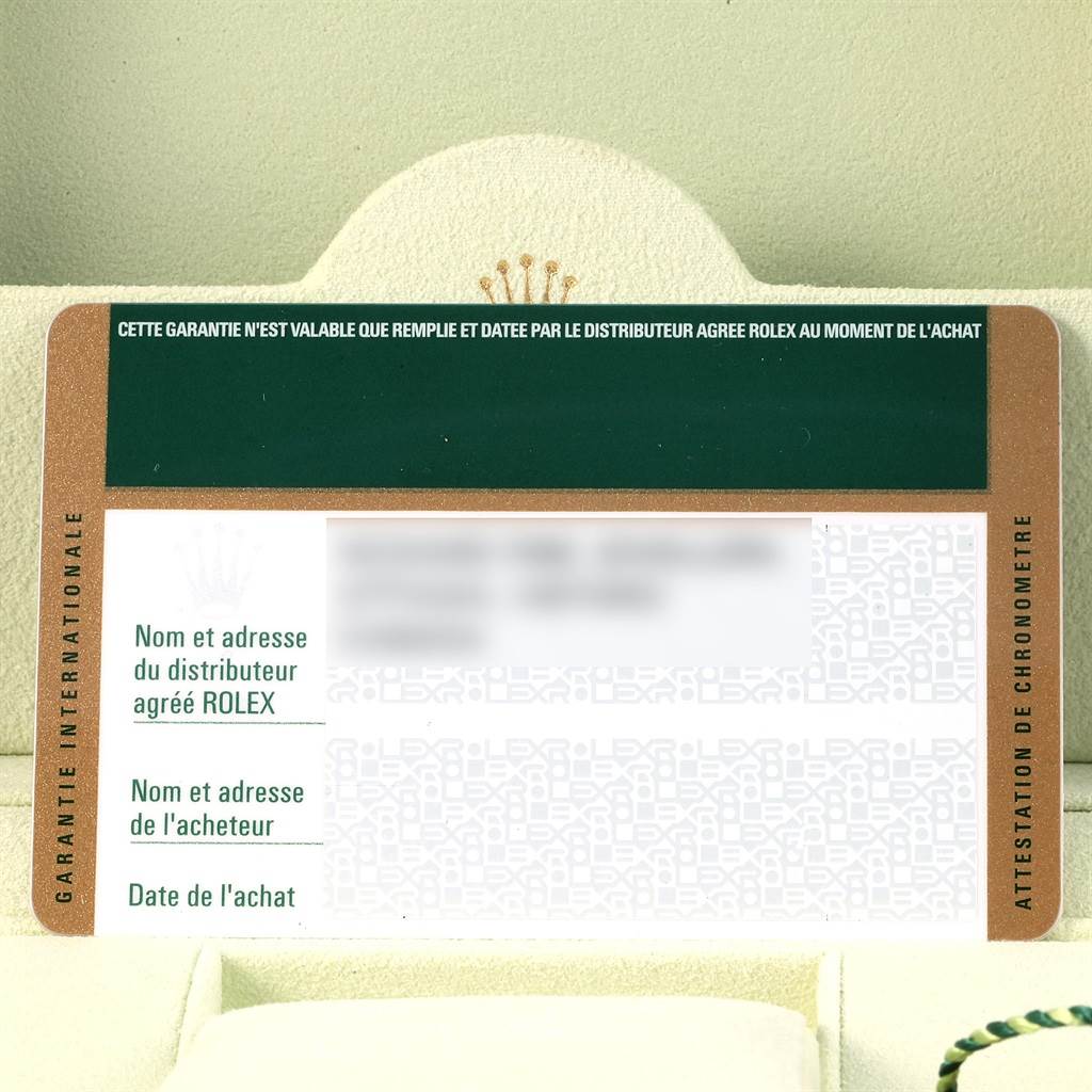 The image shows the official warranty card for a Rolex Explorer 216570 Men's Stainless Steel Black Dial 216570 Men's Stainless Steel Black Dial model, placed inside a cardholder or box.