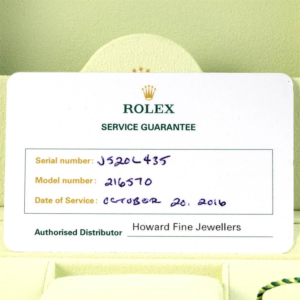 This image shows a Rolex Service Guarantee card for the Explorer model with serial number and service date details.