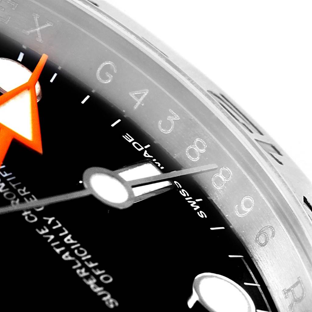 This close-up angle of the Rolex Explorer 216570 Men's Stainless Steel Black Dial 216570 Men's Stainless Steel Black Dial model watch showcases the dial, numerals, and parts of the hands.