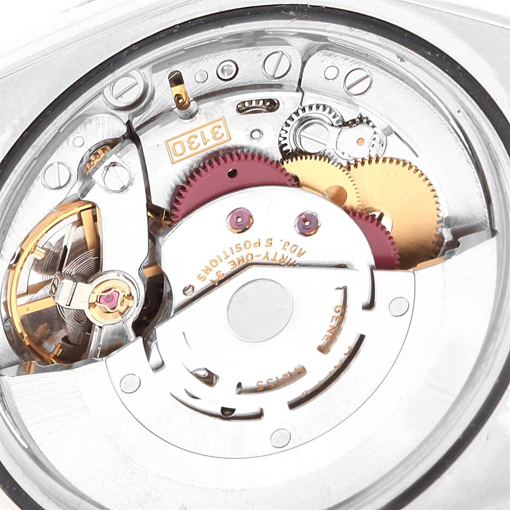 The image shows a close-up view of the Rolex Explorer 114270 Men's Stainless Steel Black Dial 114270 Men's Stainless Steel Black Dial model's intricate movement and internal mechanical parts.