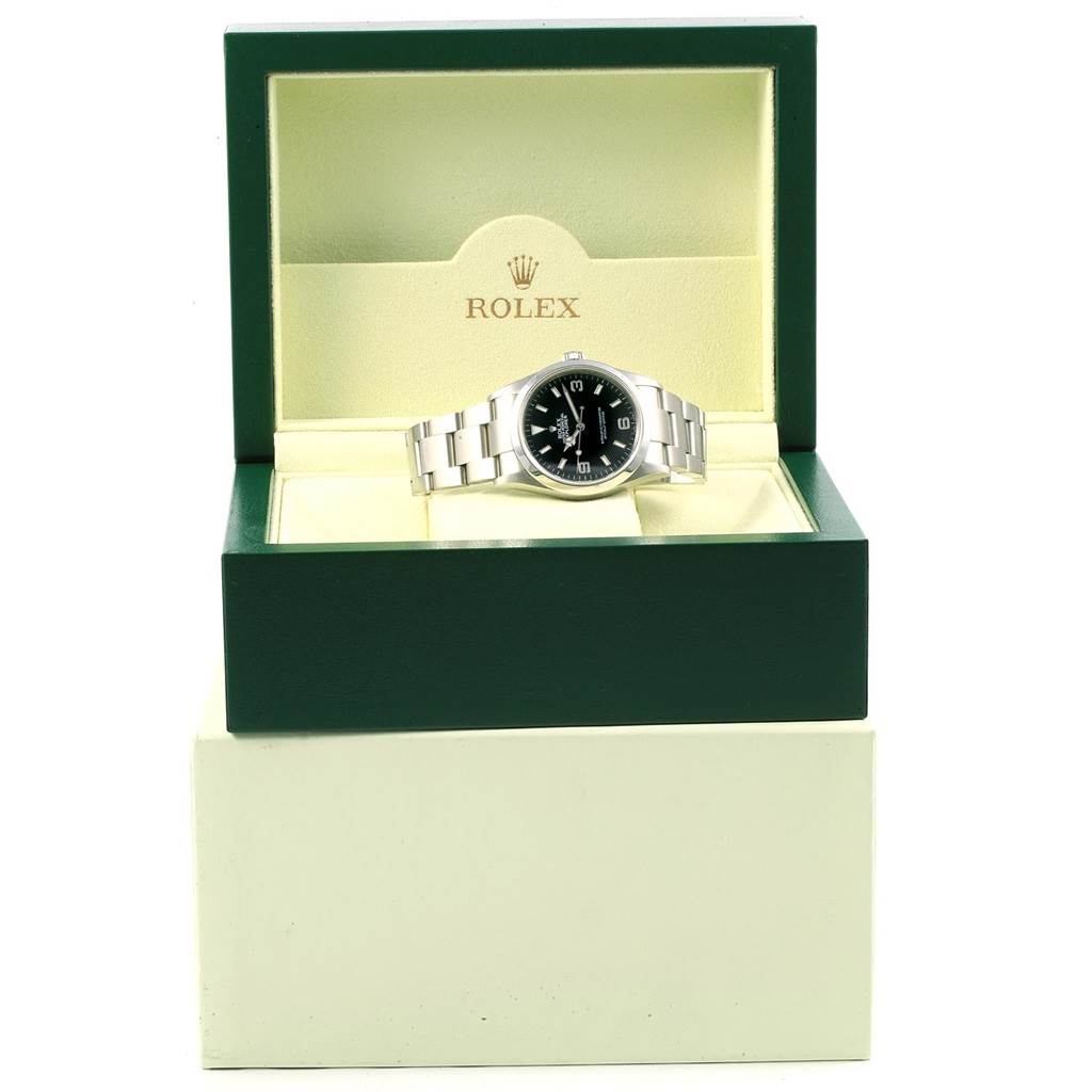 The image shows a Rolex Explorer 114270 Men's Stainless Steel Black Dial 114270 Men's Stainless Steel Black Dial watch displayed in an open green and beige Rolex box from a straight-on angle.