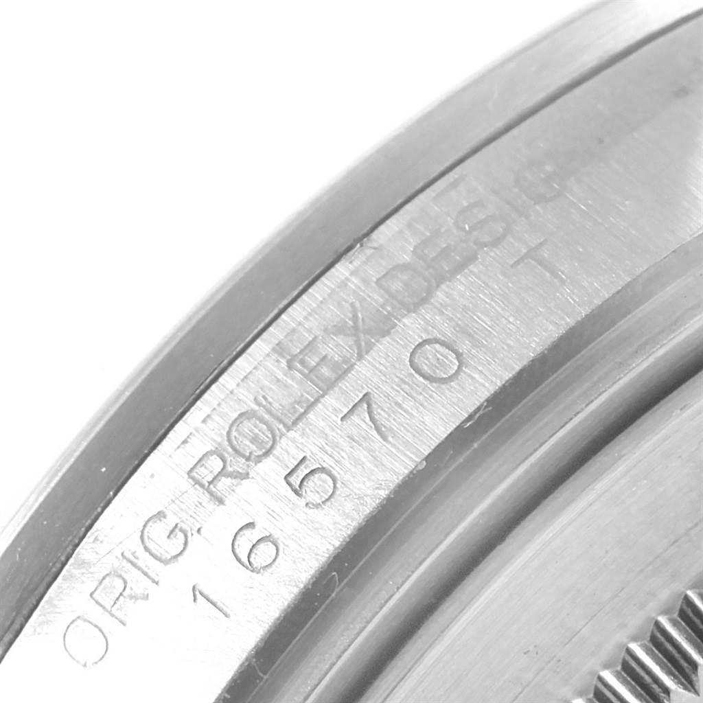 The image shows a close-up of the engraved lettering on the side of a Rolex Explorer 16570 Men's Stainless Steel Black Dial 16570 Men's Stainless Steel Black Dial watch case.