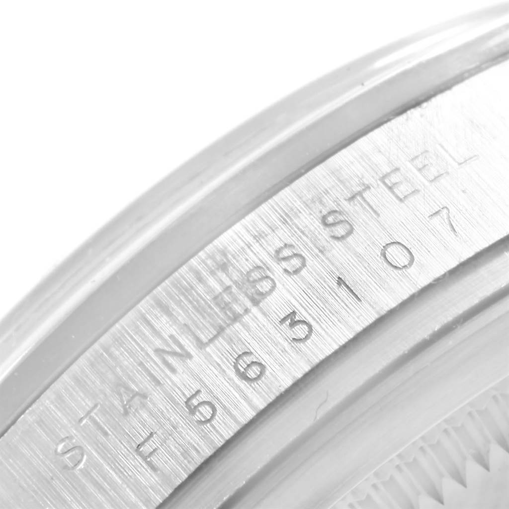 This image shows a close-up of the case side and serial number of a Rolex Explorer 114270 Men's Stainless Steel Black Dial 114270 Men's Stainless Steel Black Dial watch, highlighting its stainless steel material.