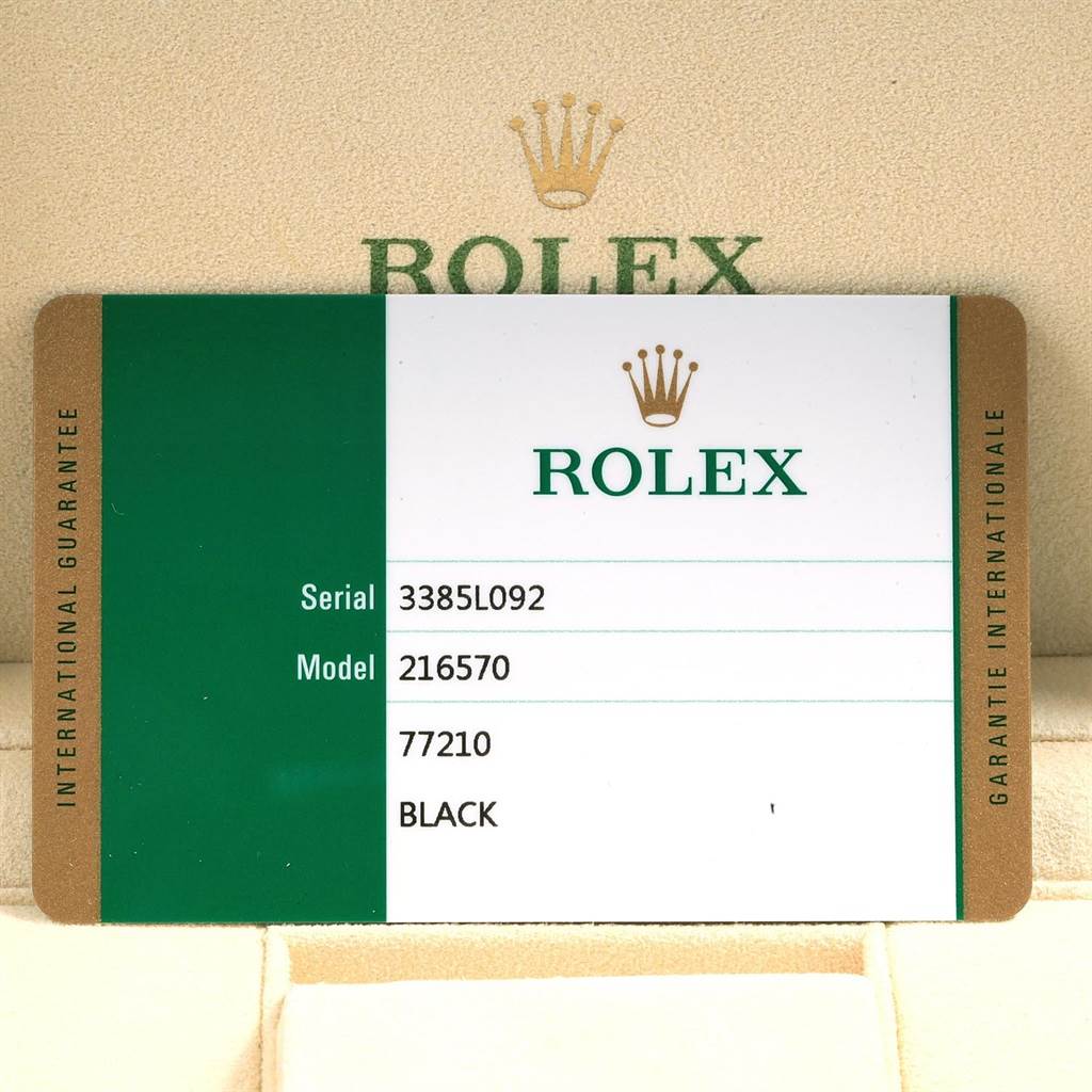 The image shows the warranty card for a Rolex Explorer 216570 Men's Stainless Steel Black Dial 216570 Men's Stainless Steel Black Dial model 216570, featuring its serial number and model details.