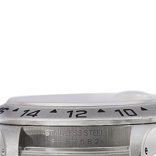 The image shows a partial side view of the bezel, case, and serial number of a Rolex Explorer 16570 Men's Stainless Steel White Dial 16570 Men's Stainless Steel White Dial.
