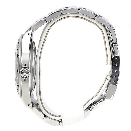 This side view of the Rolex Explorer 16570 Men's Stainless Steel White Dial 16570 Men's Stainless Steel White Dial watch shows the case, crown, and metal bracelet with the clasp.