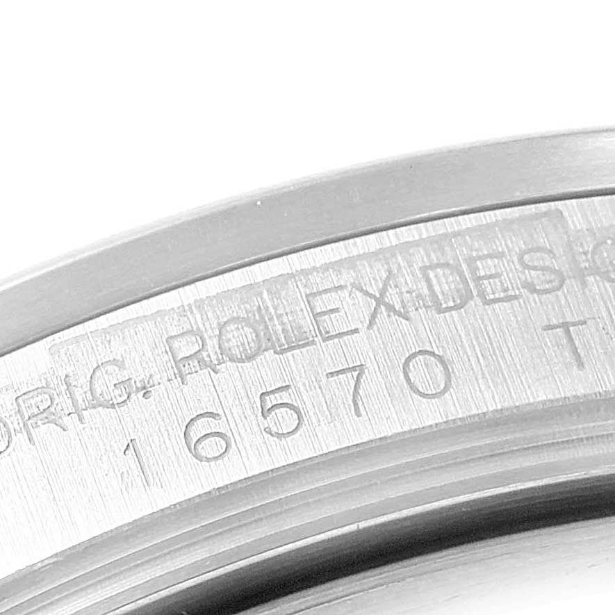 The image shows a close-up of the engraved area on the back of a Rolex Explorer 16570 Men's Stainless Steel White Dial 16570 Men's Stainless Steel White Dial watch.