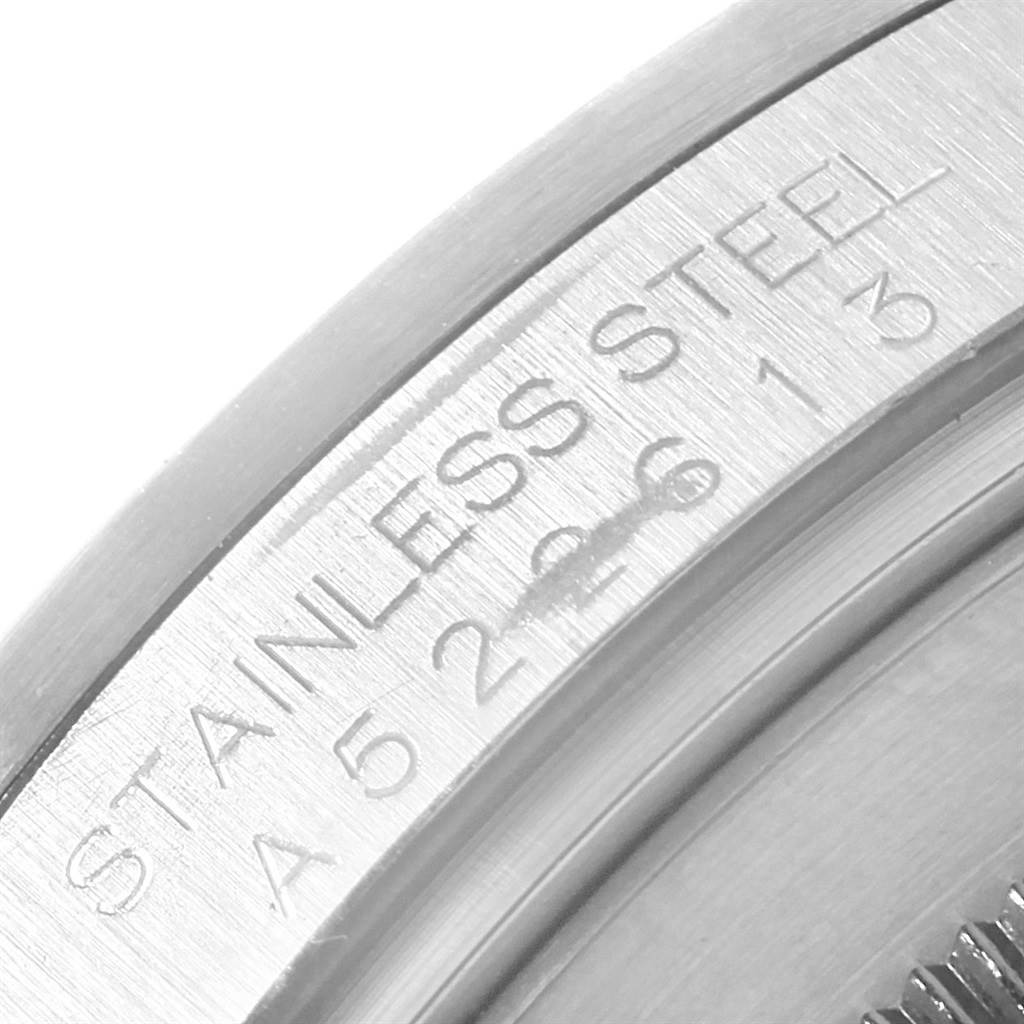 The image shows a close-up of the stainless steel back casing with engraved serial number of the Rolex Explorer 16570 Men's Stainless Steel Black Dial 16570 Men's Stainless Steel Black Dial watch.