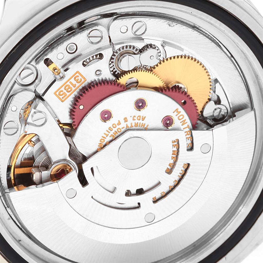 This image shows the Rolex Explorer 16570 Men's Stainless Steel Black Dial 16570 Men's Stainless Steel Black Dial watch's internal mechanism, featuring gears and the rotor, viewed from the back.