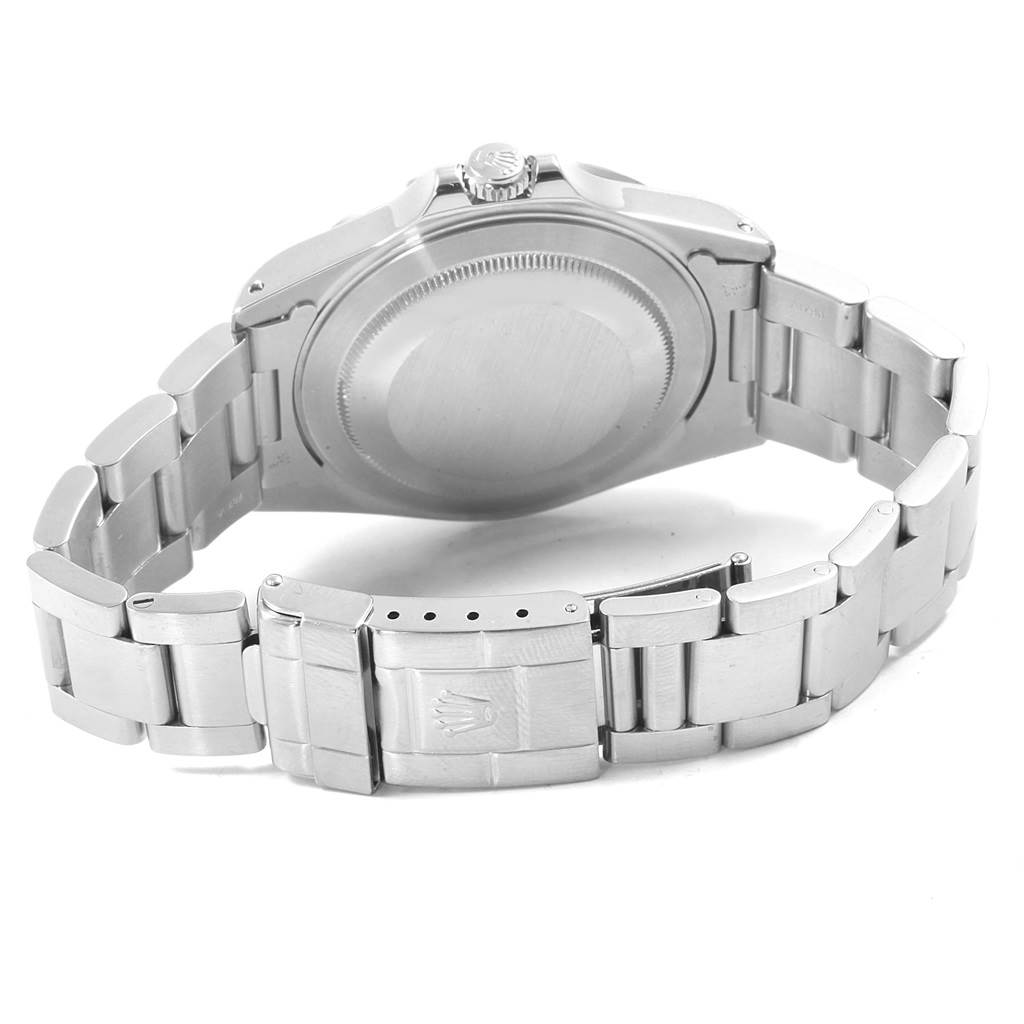 The image shows the back view of a Rolex Explorer 16570 Men's Stainless Steel Black Dial 16570 Men's Stainless Steel Black Dial watch, highlighting its case back, crown, and metal bracelet with the clasp open.