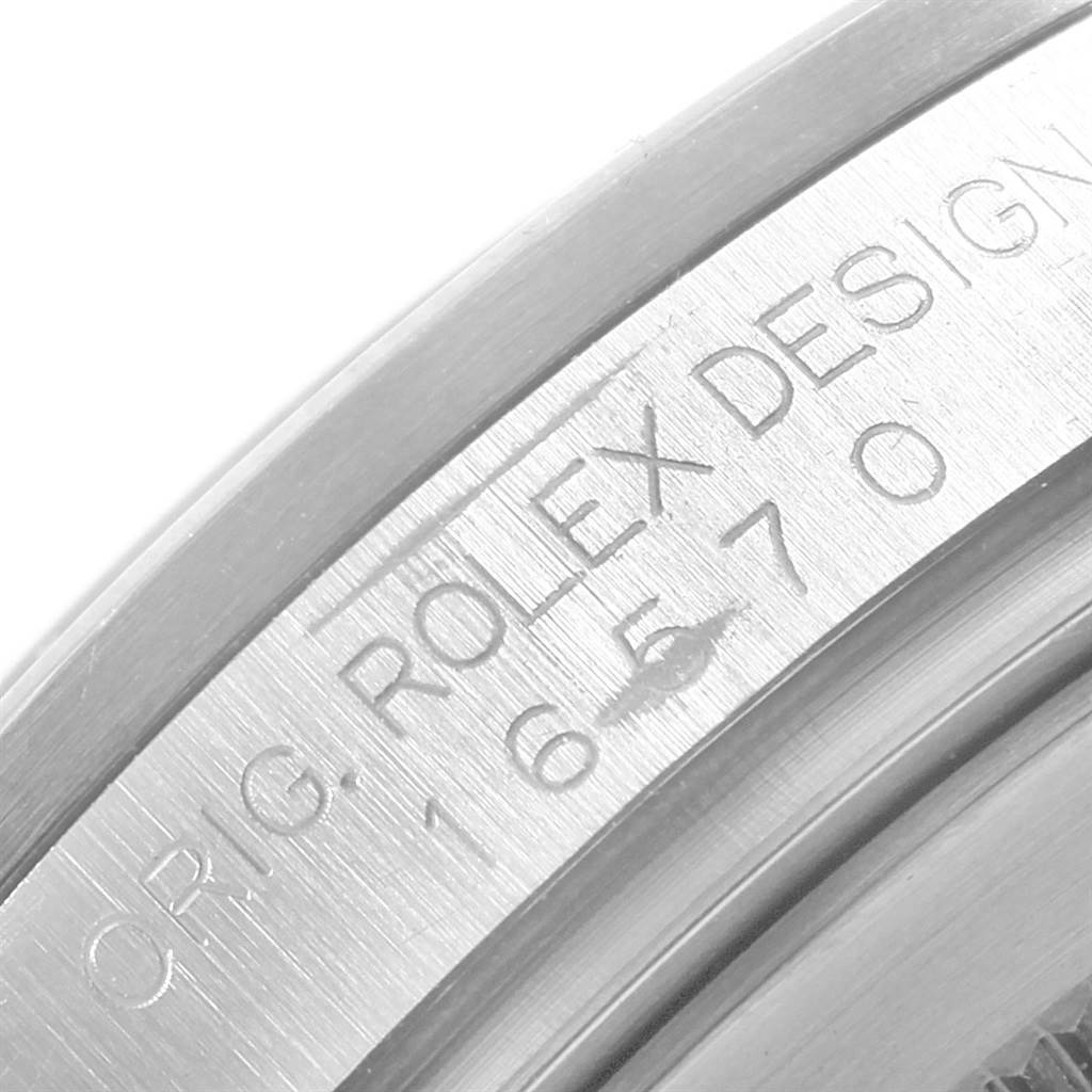 The image shows a close-up of the engraved inner bezel of the Rolex Explorer 16570 Men's Stainless Steel Black Dial 16570 Men's Stainless Steel Black Dial model.