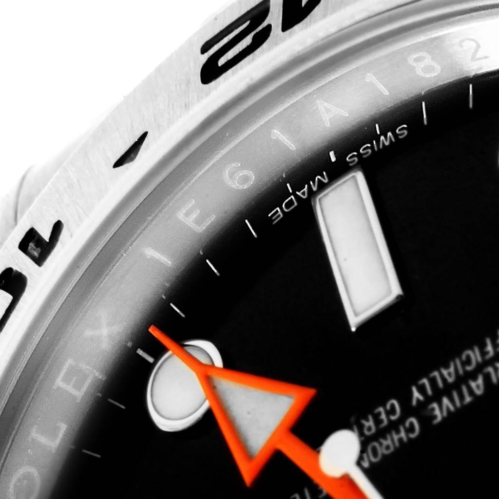 The image shows a close-up of the dial, bezel, and orange hand of a Rolex Explorer 216570 Men's Stainless Steel Black Dial 216570 Men's Stainless Steel Black Dial watch.