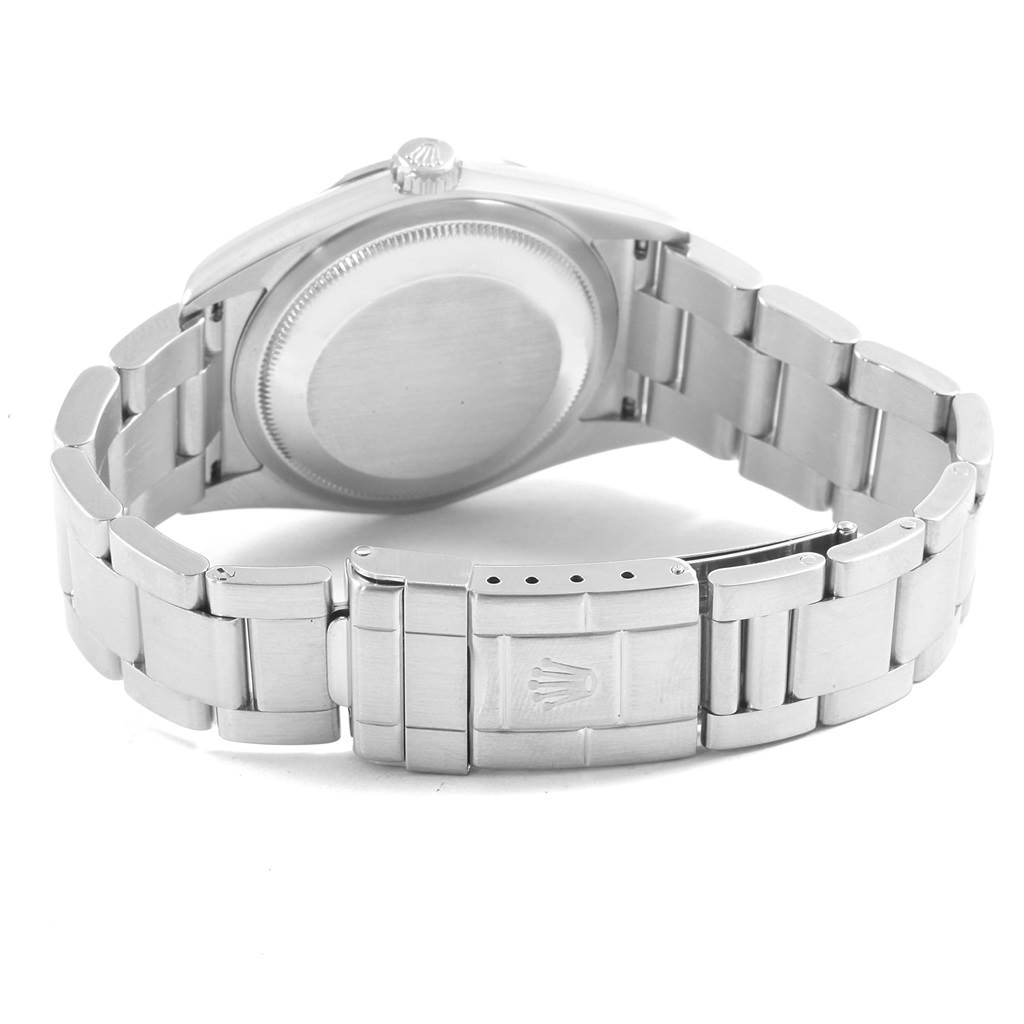 The image shows the Rolex Explorer 114270 Men's Stainless Steel Black Dial 114270 Men's Stainless Steel Black Dial watch from a rear angle, highlighting its back case and stainless steel bracelet clasp.